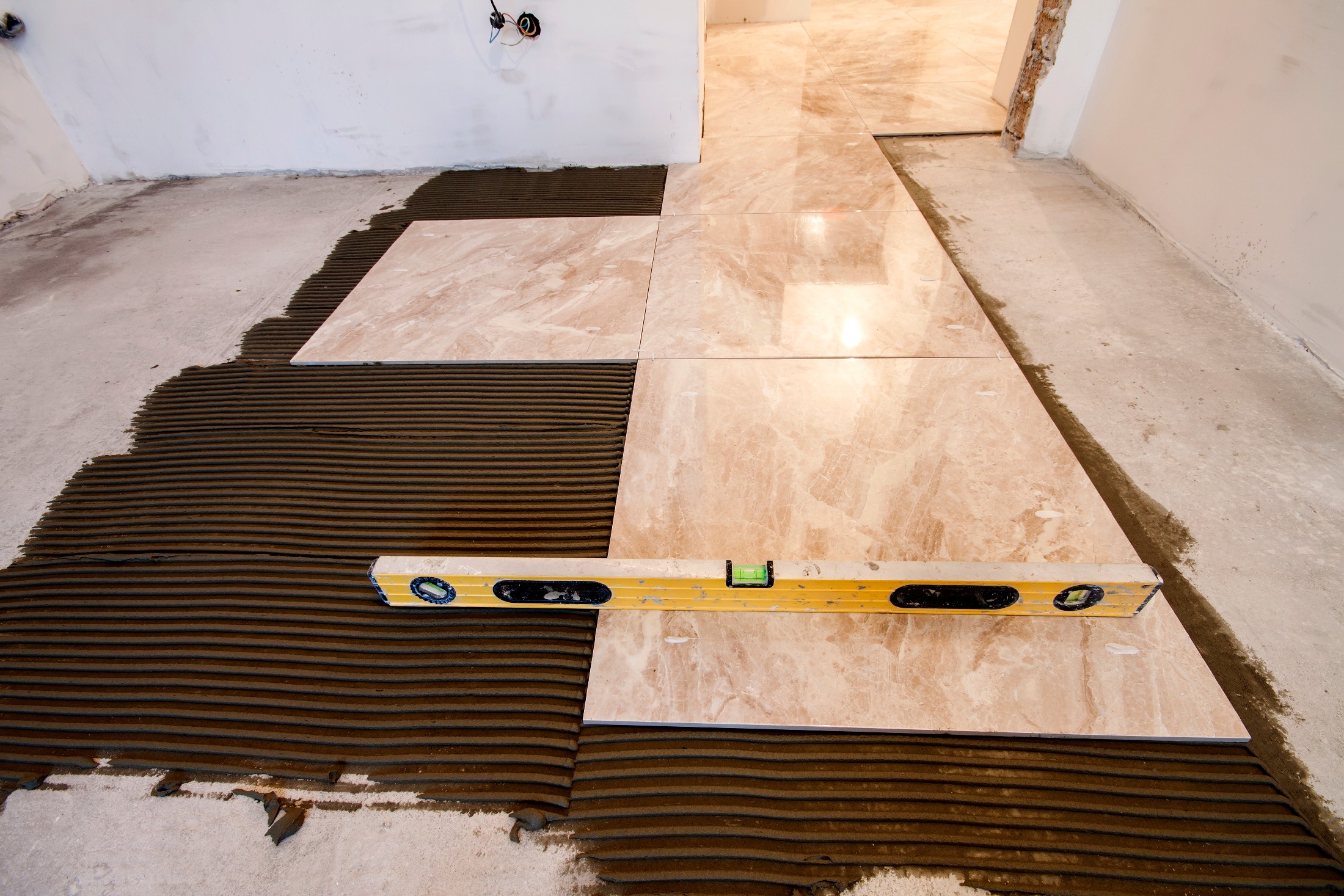 Ceramic Tiles And Tools For Tiler. Floor Tiles Installation. Home Improvement, Renovation Ceramic Tile Floor Adhesive, Mortar, Level